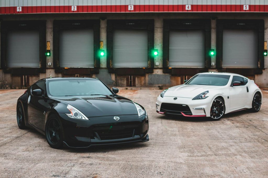 two nissan sports cars parked