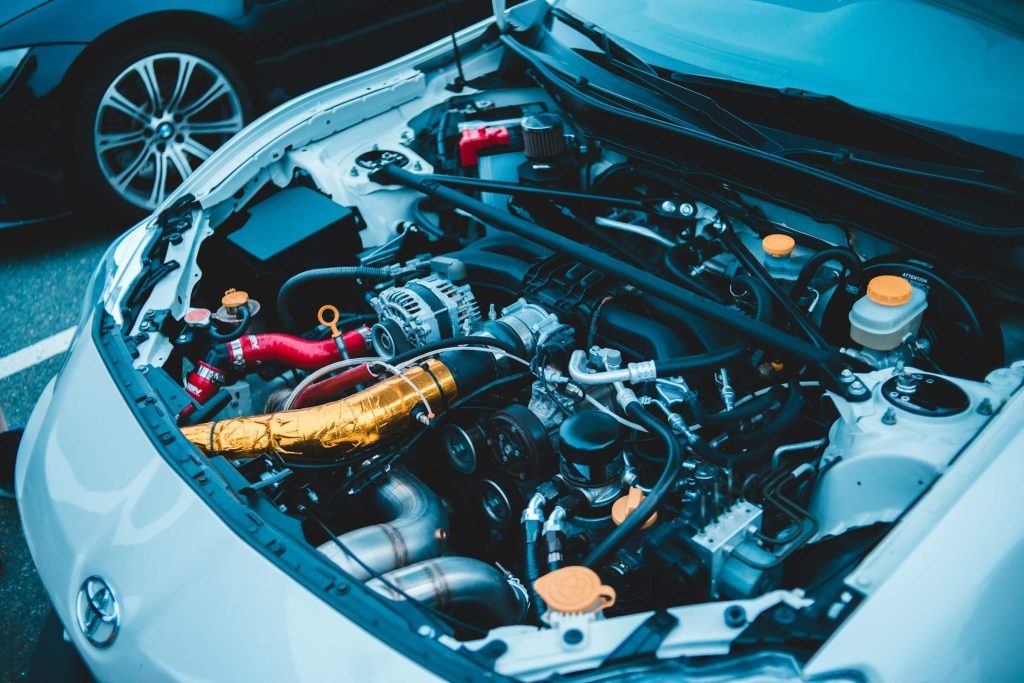 white car engine bay view